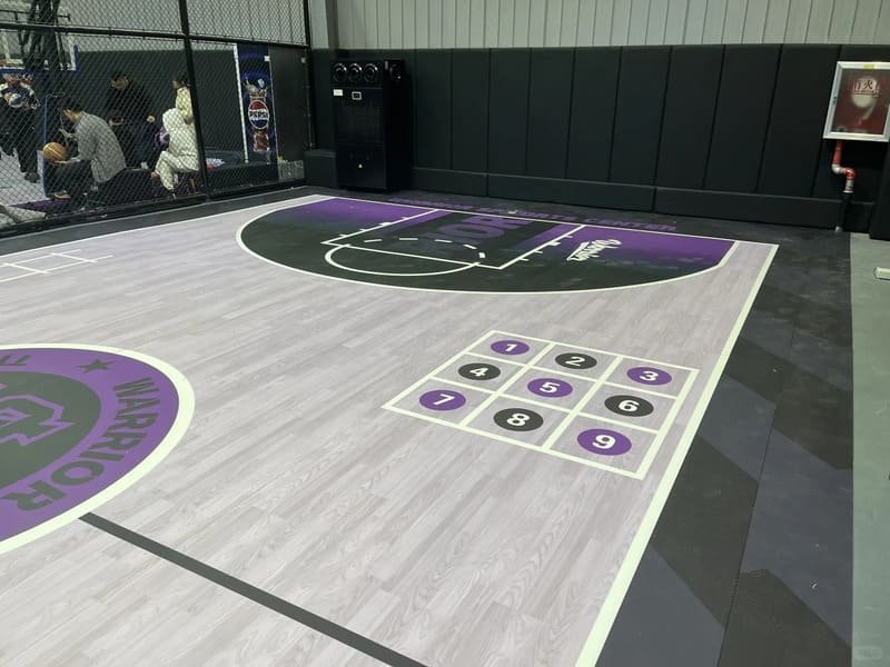 Slip resistance testing on sports flooring with logo